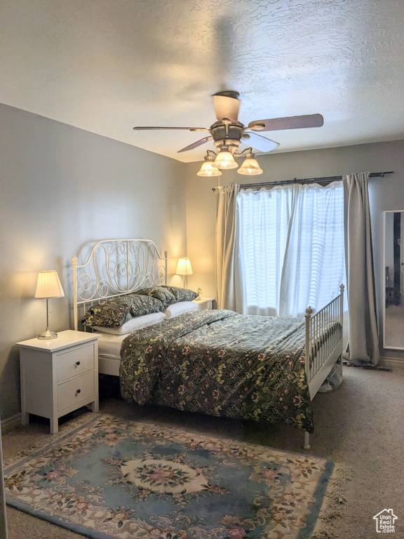Bedroom featuring carpet and a ceiling fan