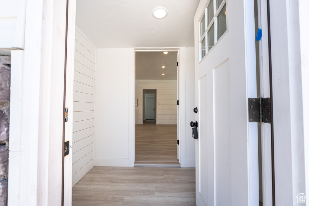 Corridor featuring recessed lighting and light wood-style floors