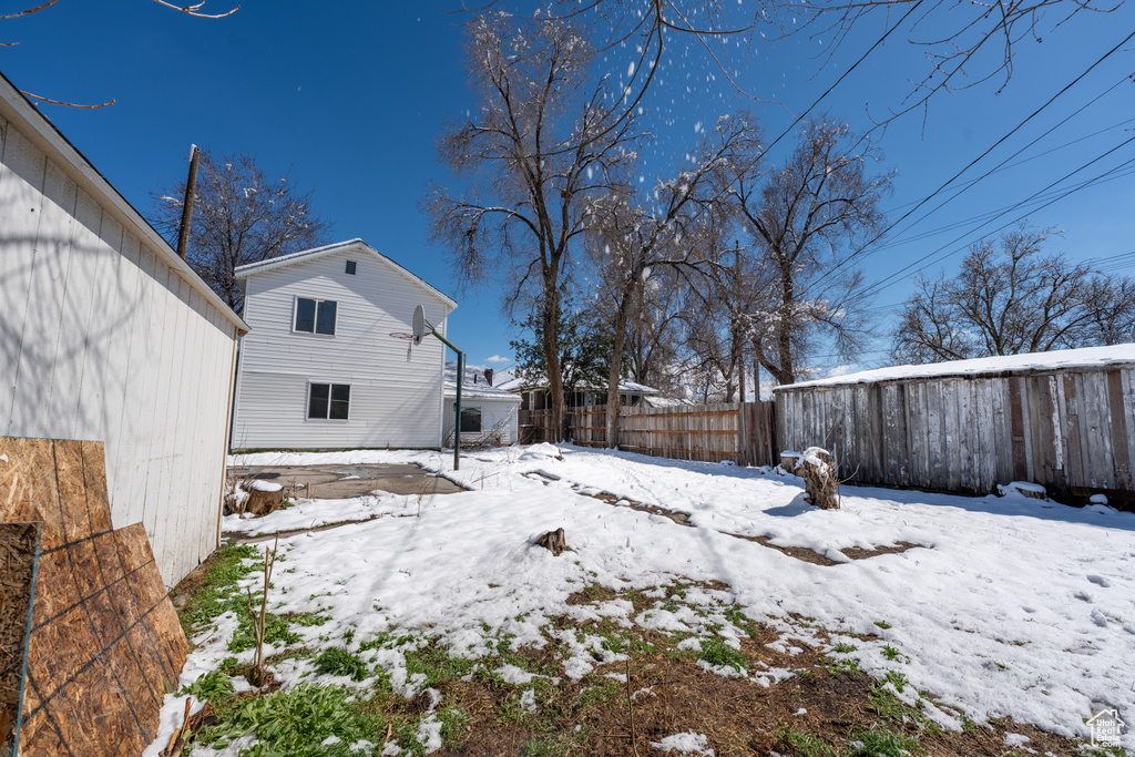 View of yard layered in snow