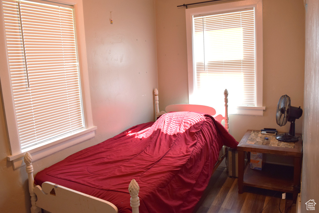 Bedroom with wood finished floors