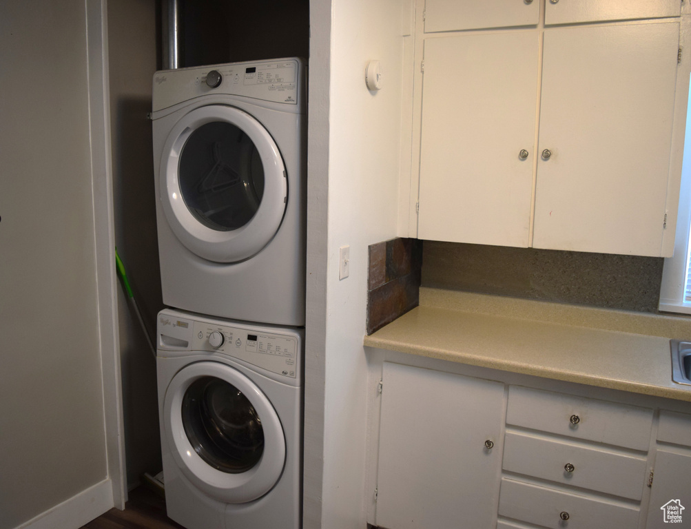 Laundry area with stacked washer / dryer