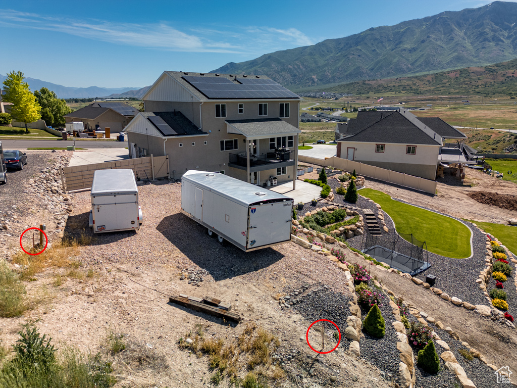 Aerial perspective of suburban area featuring a mountain backdrop