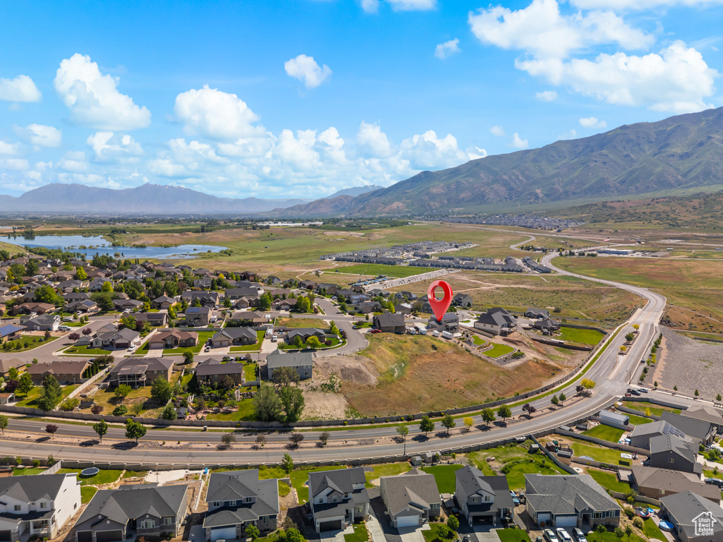 Aerial perspective of suburban area featuring a water and mountain view