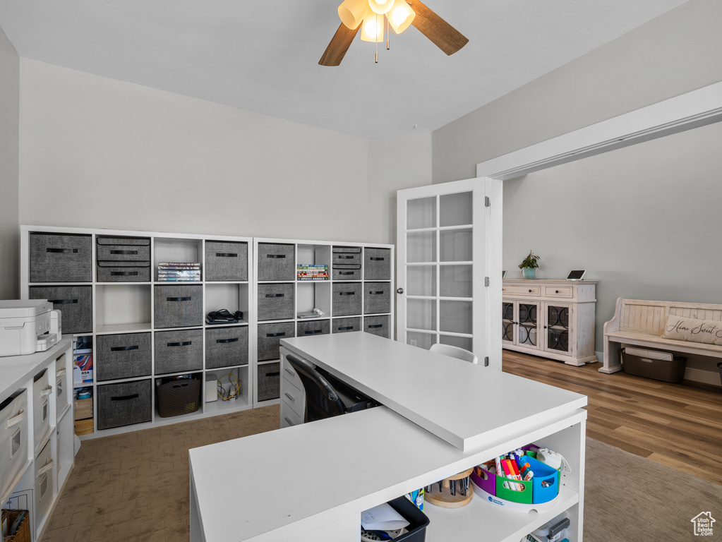 Home office featuring ceiling fan and wood finished floors