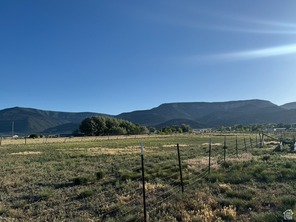 View of mountain backdrop with rural landscape
