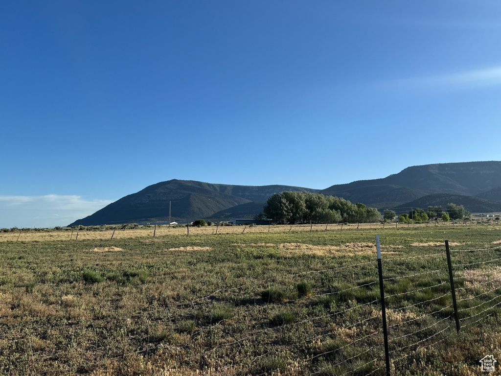 View of mountain background featuring rural landscape