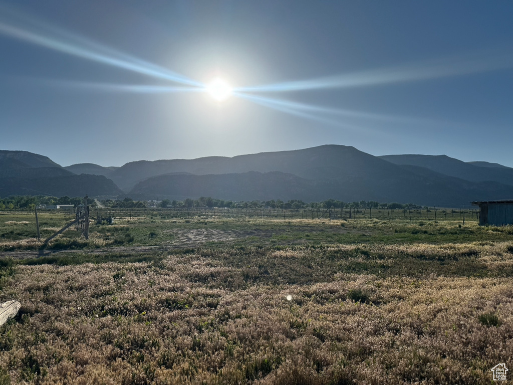 View of mountain backdrop with rural landscape