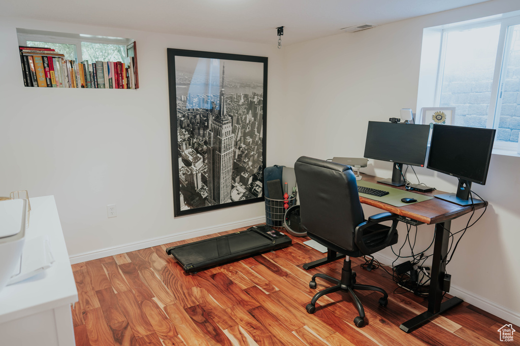 Office featuring healthy amount of natural light, wood finished floors, and baseboards