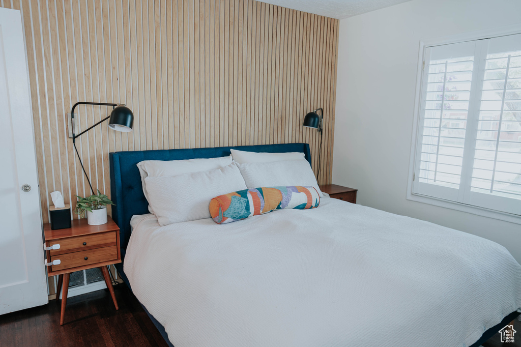 Bedroom featuring dark wood-style floors