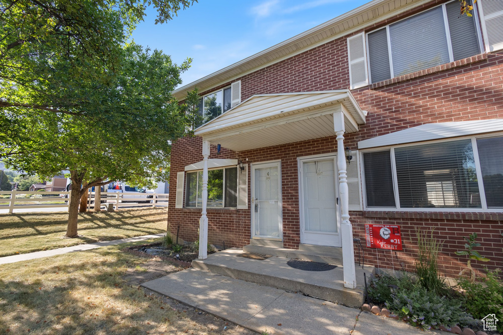View of front of house featuring brick siding