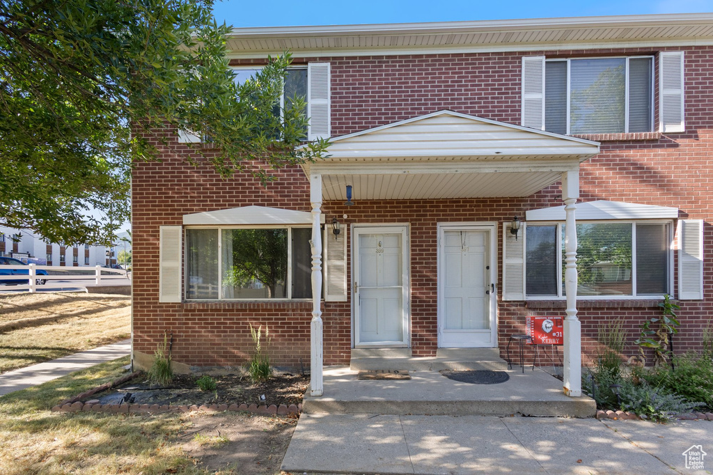 View of front of house with brick siding