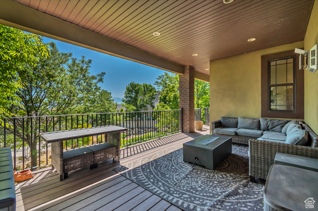 Wooden terrace with an outdoor living space
