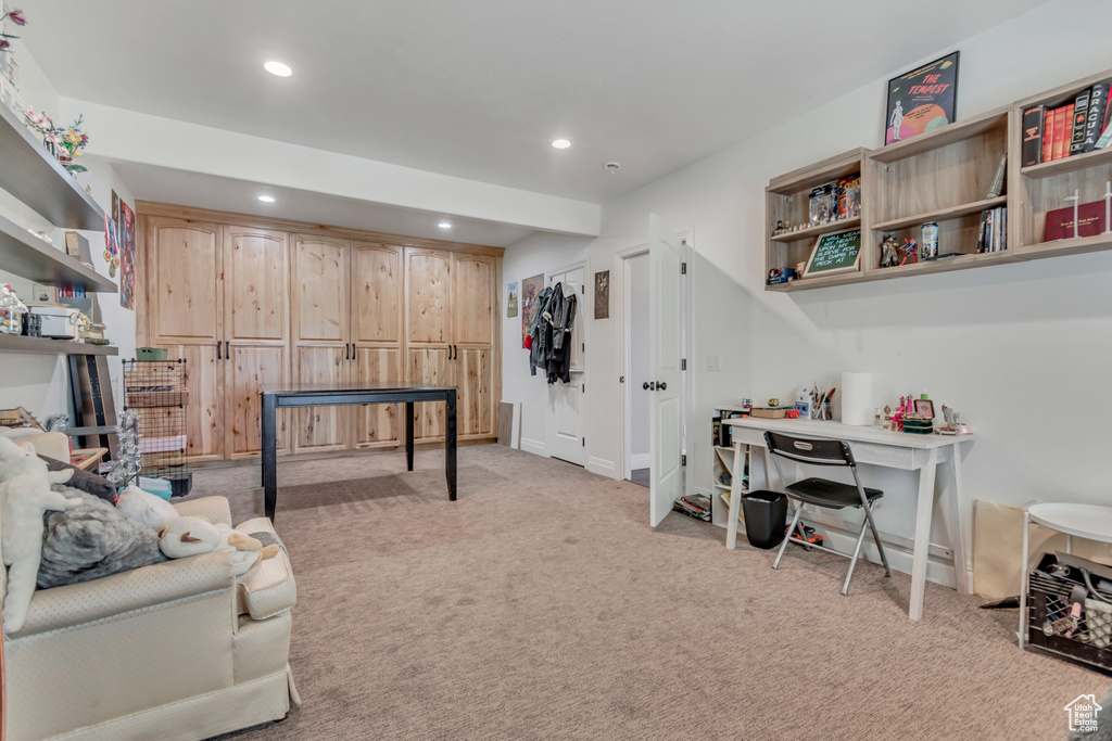 Home office featuring recessed lighting, light colored carpet, and baseboards