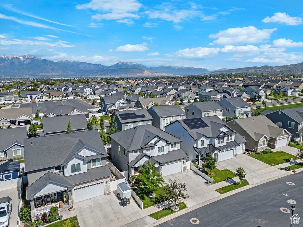Aerial perspective of suburban area featuring a mountainous background