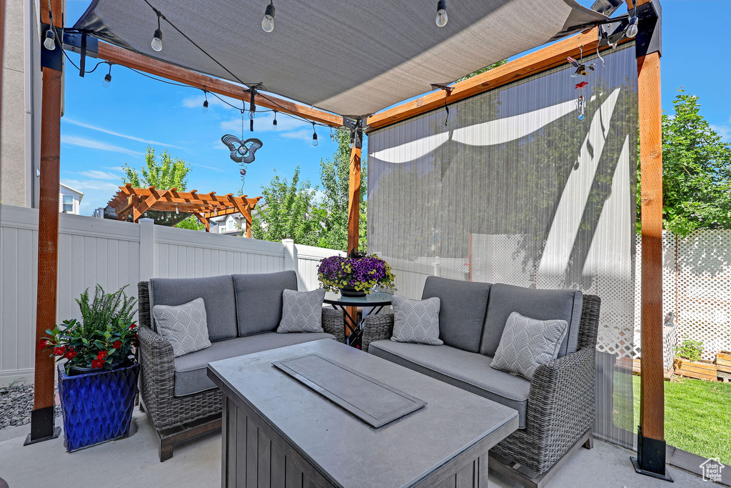 Fenced backyard featuring an outdoor hangout area and a patio area