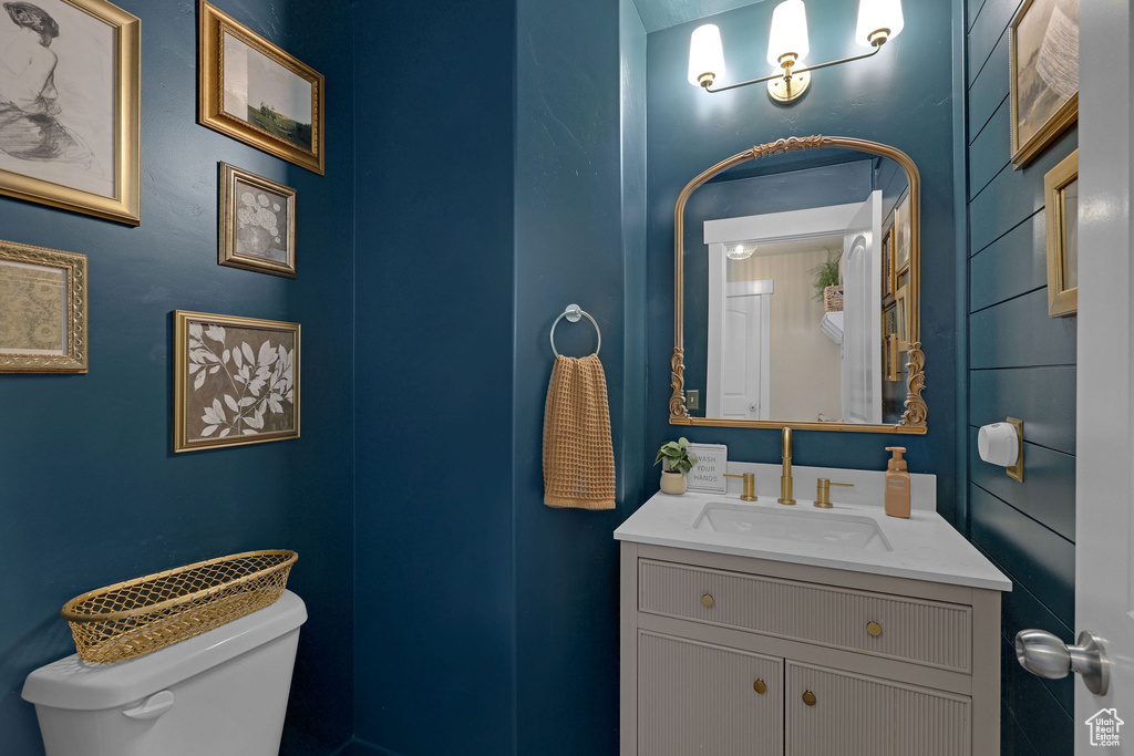 Half bath with vanity and toilet