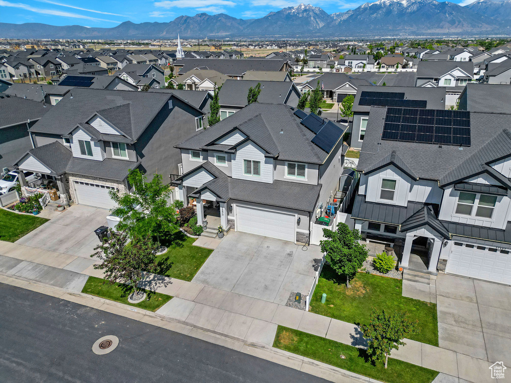 Aerial perspective of suburban area featuring a mountainous background