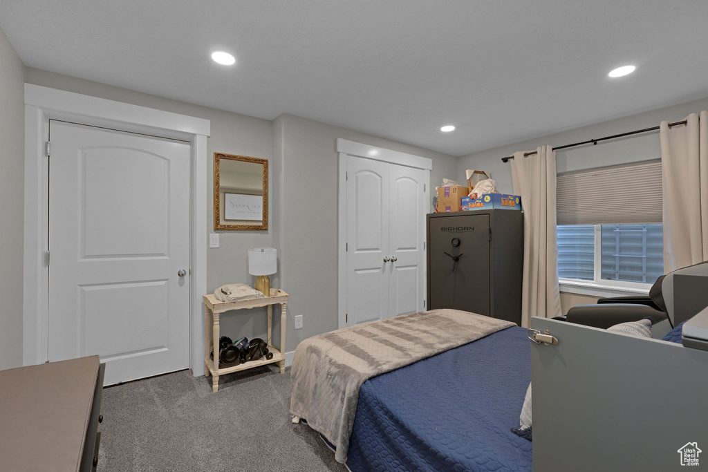 Bedroom featuring carpet, recessed lighting, and a closet