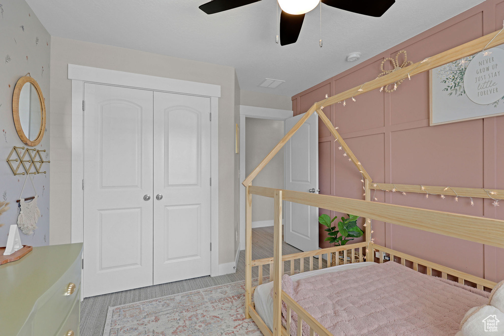 Bedroom featuring a closet and ceiling fan