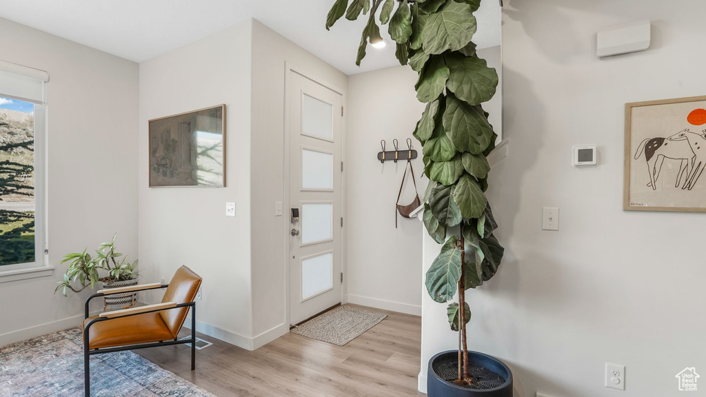 Entryway featuring light wood finished floors and baseboards