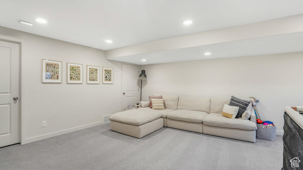 Living area featuring carpet, recessed lighting, and baseboards