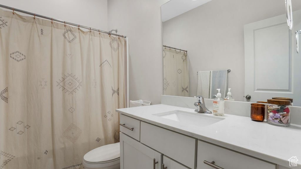 Full bathroom featuring vanity and toilet
