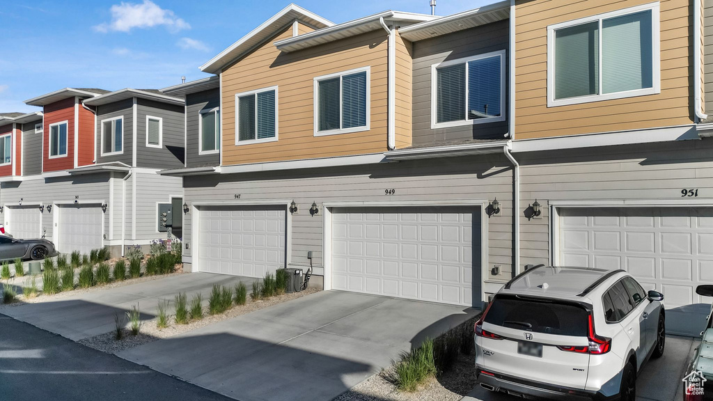 Multi unit property with a garage and driveway