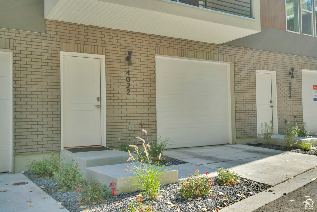 Doorway to property with brick siding