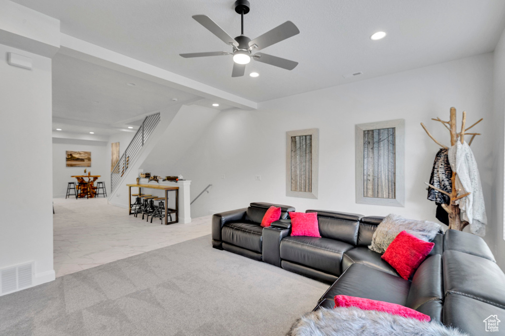 Living room featuring recessed lighting, a ceiling fan, stairway, and marble finish flooring