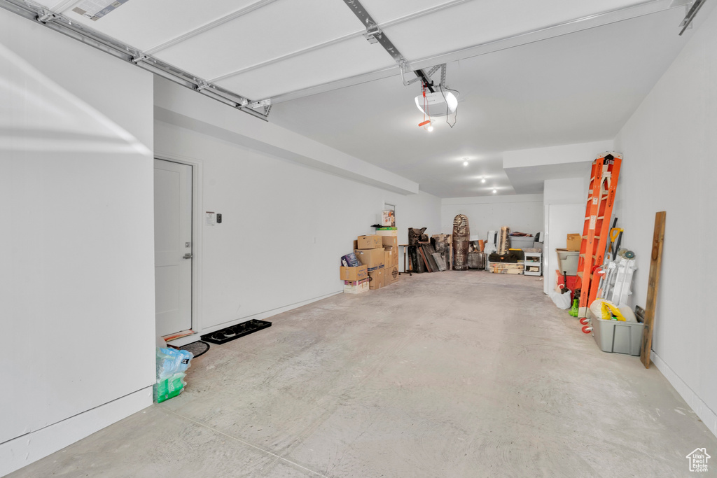 Garage featuring a garage door opener