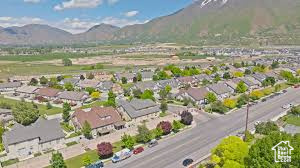 Aerial overview of property\'s location featuring a mountain backdrop and nearby suburban area