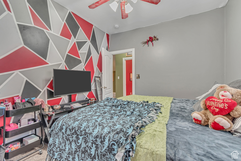 Bedroom with carpet flooring and a ceiling fan