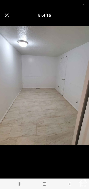 Spare room with baseboards