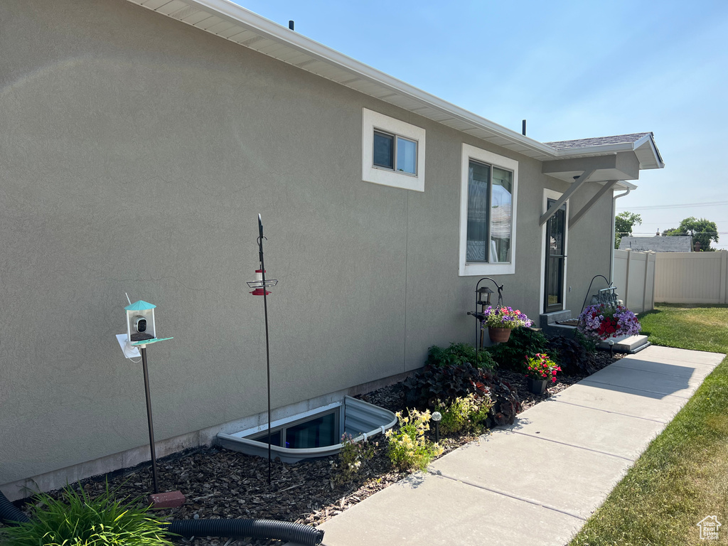 View of side of property with stucco siding