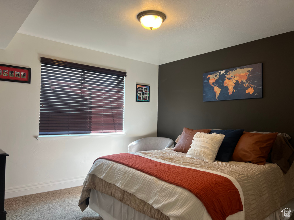 Bedroom with carpet and baseboards
