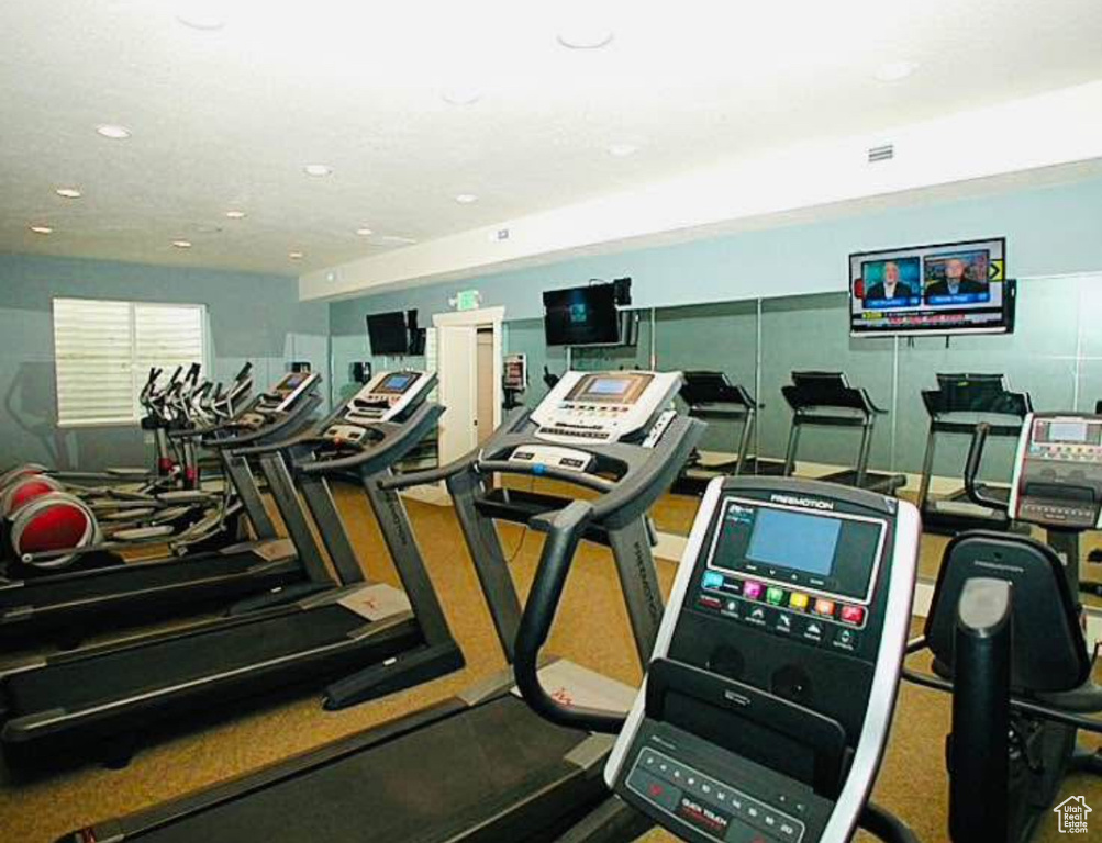 Exercise room featuring recessed lighting