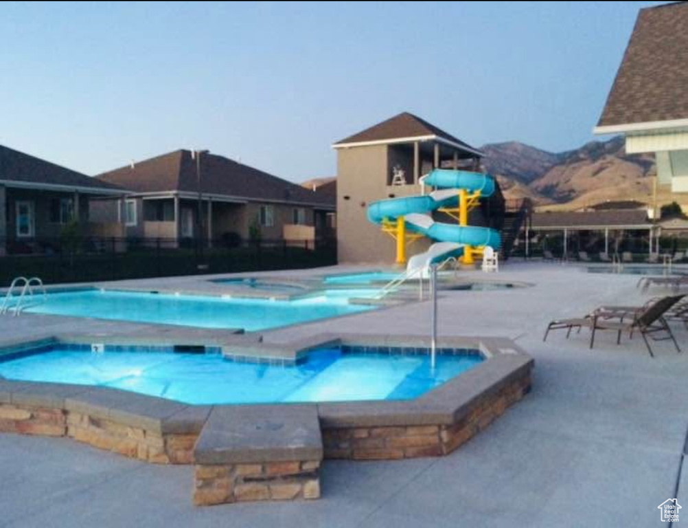 Community pool featuring a community hot tub