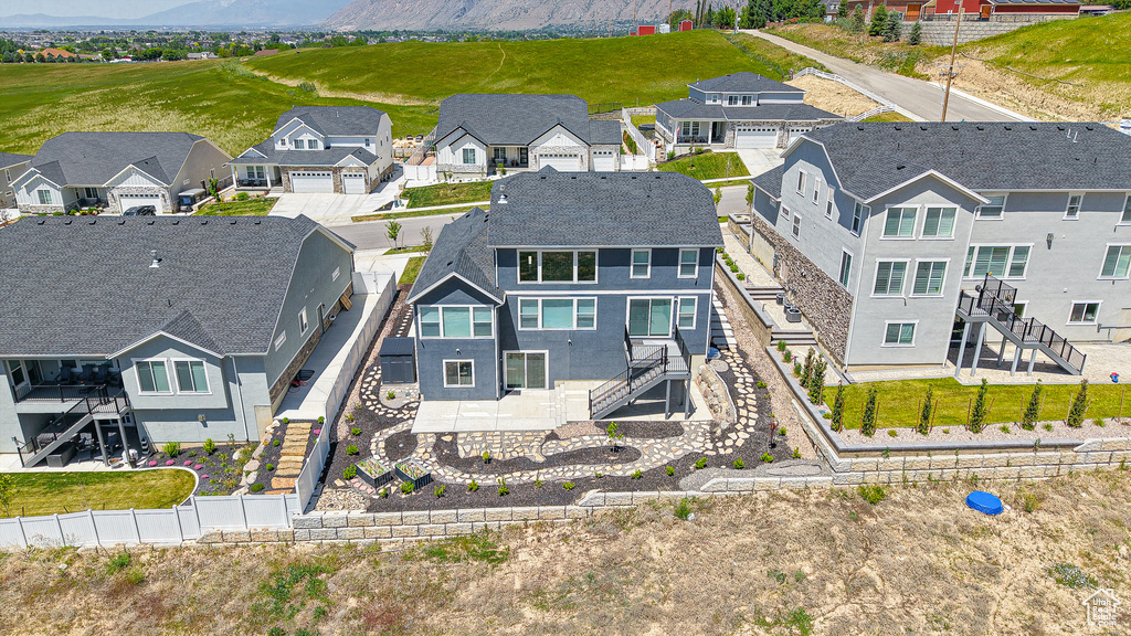 Aerial perspective of suburban area with a mountainous background