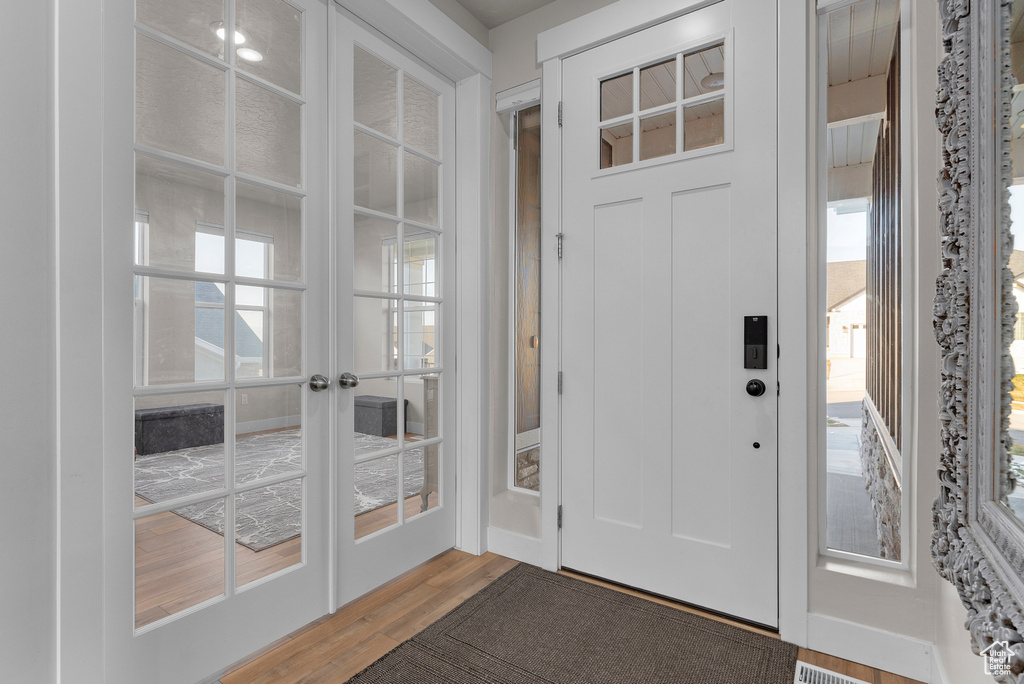 Foyer with wood finished floors