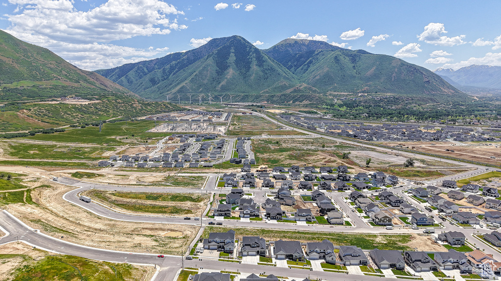 View of property location with mountains and nearby suburban area