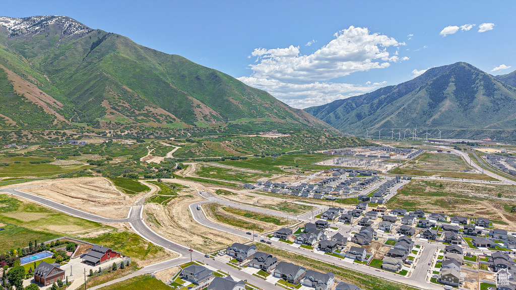 View of property location featuring a mountainous background and nearby suburban area