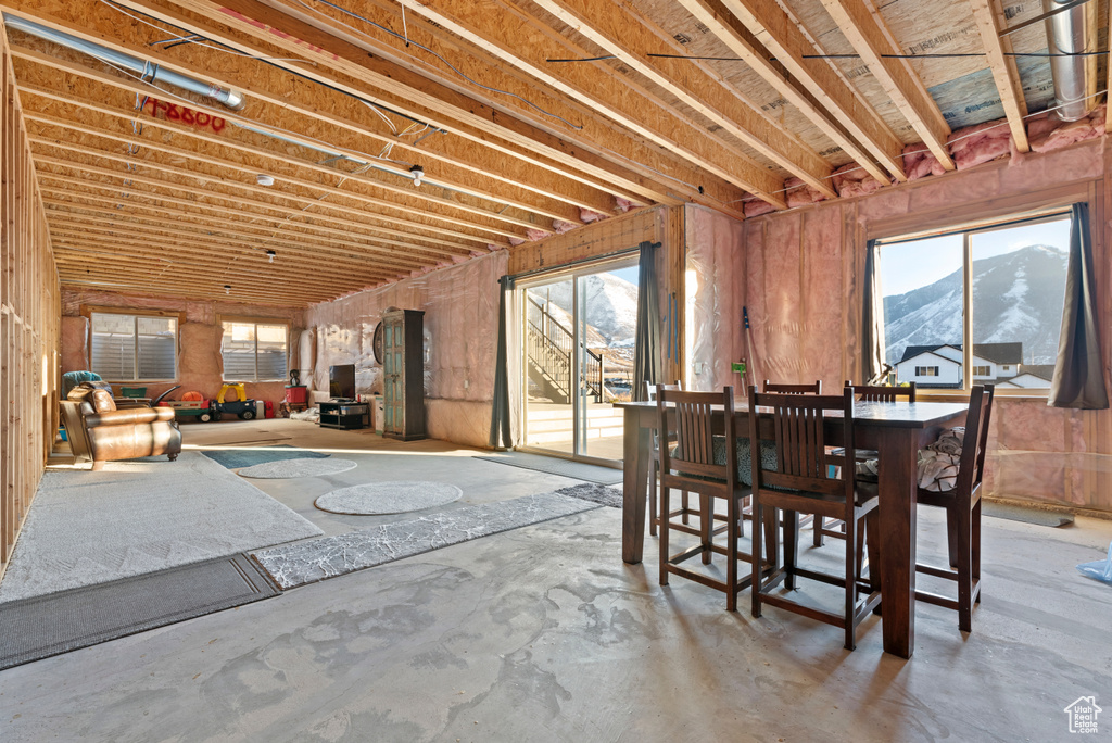 Dining room featuring concrete flooring and a mountain view