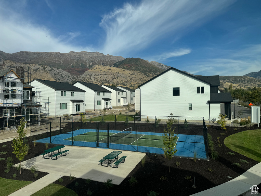 View of tennis court featuring a mountain view