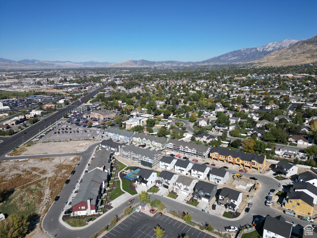 Aerial overview of property\\\\\\\'s location with a mountain backdrop and nearby suburban area