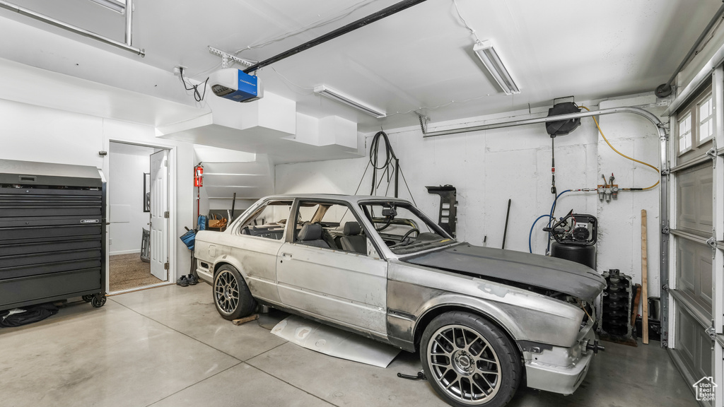 Garage featuring a garage door opener