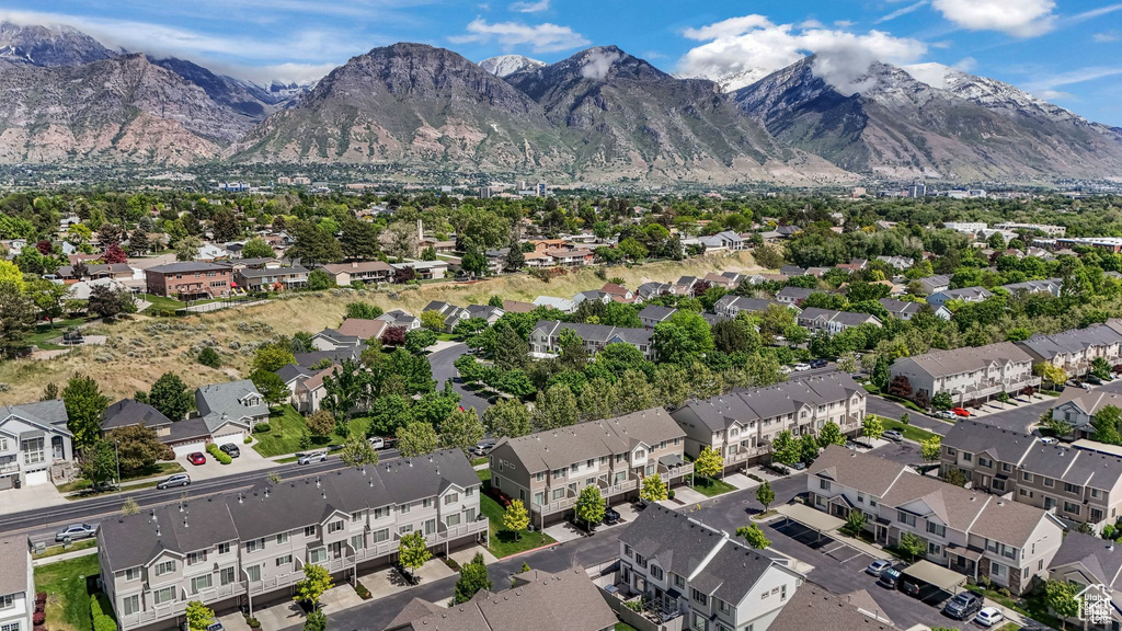 Aerial view of property\'s location with nearby suburban area and mountains
