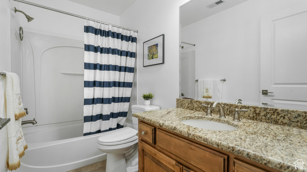 Full bathroom with vanity, toilet, and shower / bathtub combination with curtain