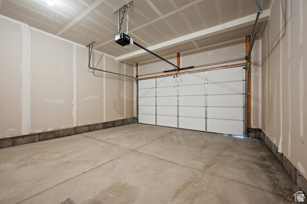 Garage featuring a garage door opener