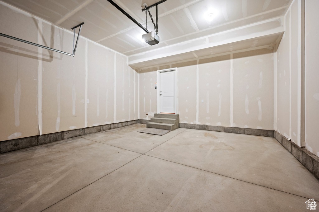 Garage featuring a garage door opener