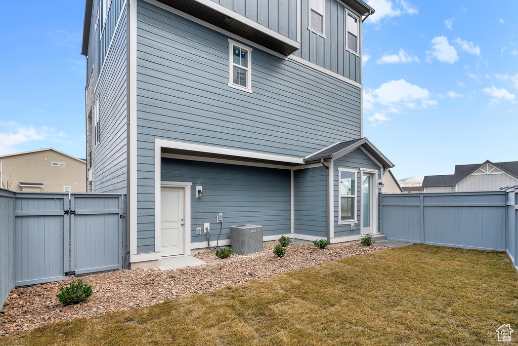 Rear view of property with a gate